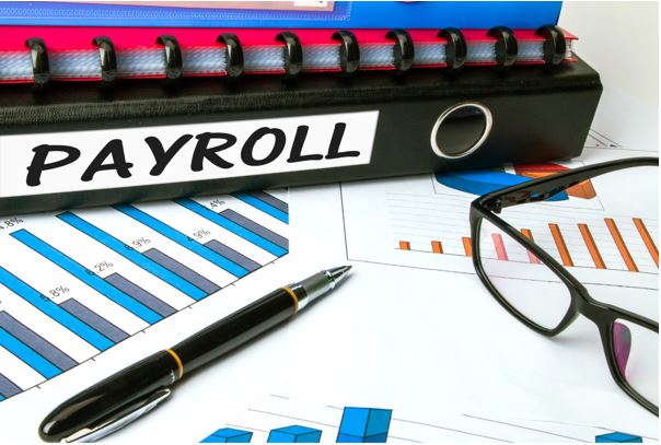 Photo of files with the label 'payroll'